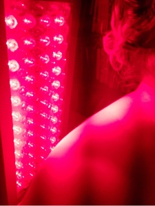 Woman using Red Light Therapy for healing